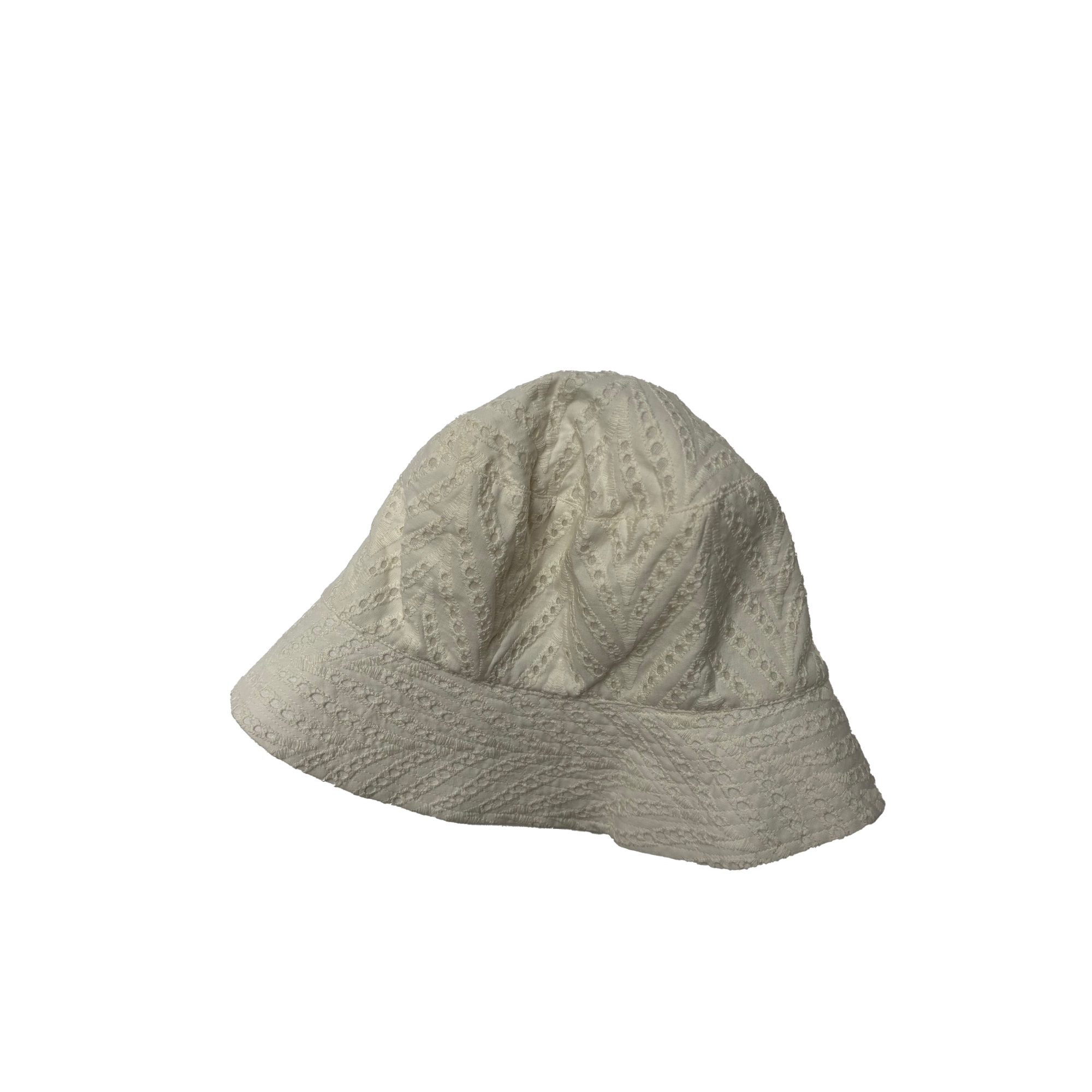 A cream-colored bucket hat with broderie anglaise detailing.